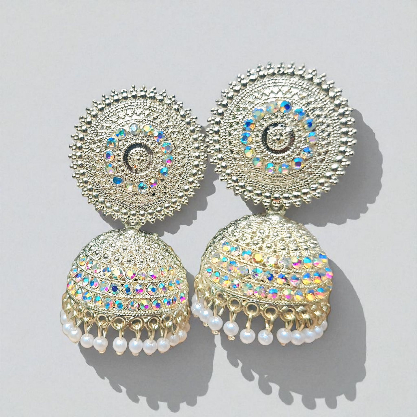 Bell-shaped jhumka adorned with shimmering stones ✨